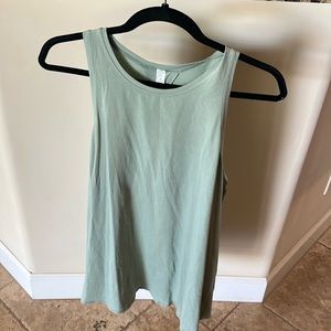 Size 12 sea foam green open back tank top from lululemon.